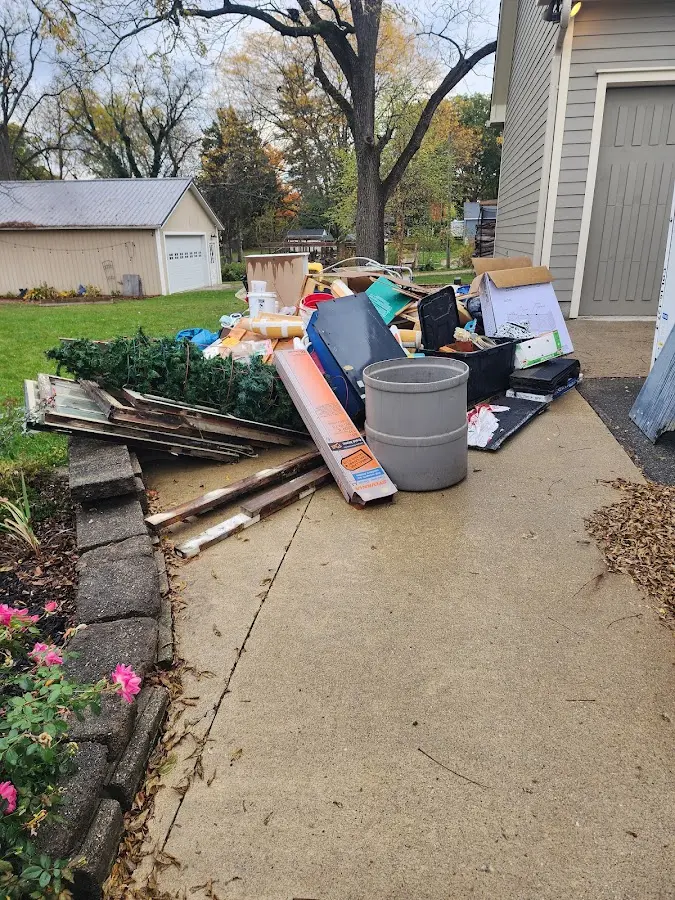 Dumpster being loaded with debris for Residential Dumpster Rental in Martinez